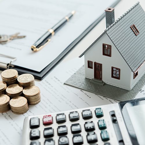 house-model-with-real-estate-agent-customer-discussing-contract-buy-house-insurance-loan-real-estate-background